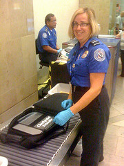 TSA agent (photo from http://www.flickr.com/photos/mobileedgelaptopbags/4119819621/in/photostream/)